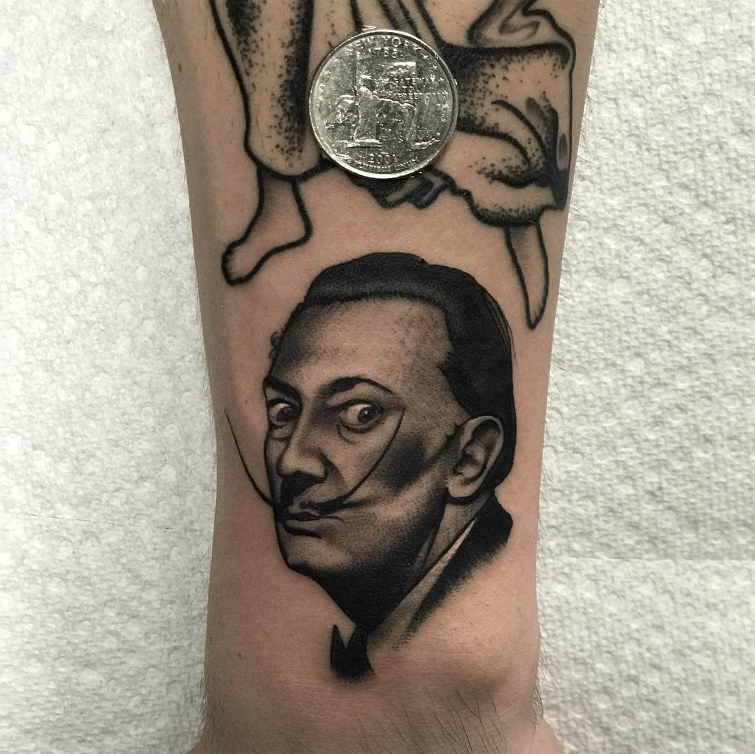 Salvador Dali tiny self portrait tattoo